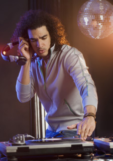 Man mixing sound at a dance club.