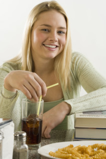 Young woman having a quick meal.