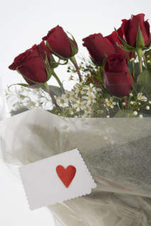 Red roses with valentine card.