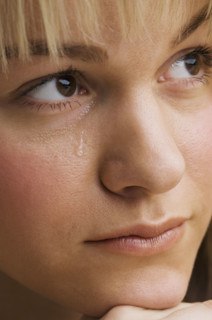 Close up of woman crying.