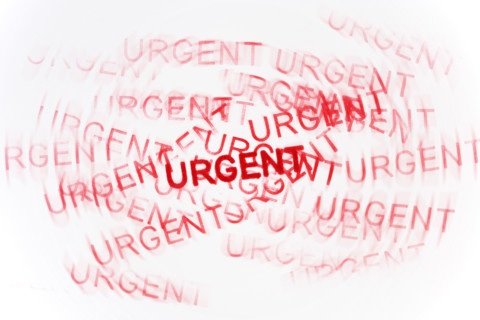 Studio shot of Urgent stamp.