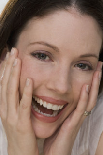 Close up of woman laughing.