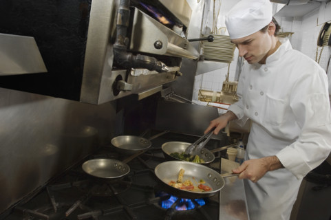 Male chef in restaurant kitchen.