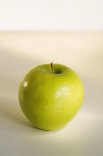 Close up of apple on table.