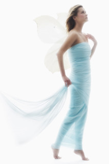 Young woman in full length gown.