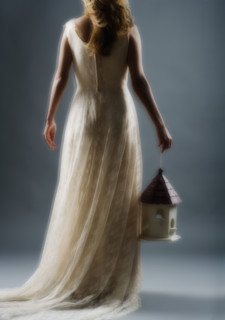 Woman wearing a long white dress.
