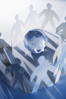 Chain of paperdoll cutouts with globe in center.