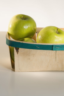 Close up of apples in basket.
