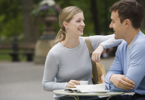 Couple having coffee at outdoor café.