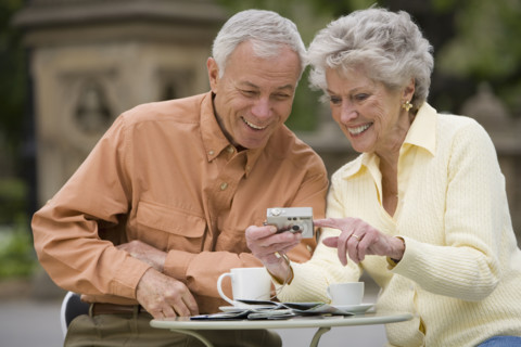 Senior couple having coffee at outdoor café.