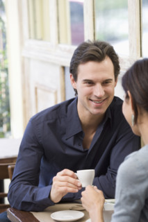 Couple having coffee at restaurant.