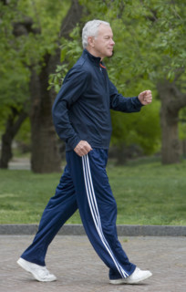 Senior man power walking.