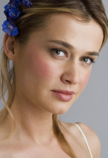 Young woman wearing a hair ornament.