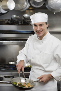 Male chef in restaurant kitchen.