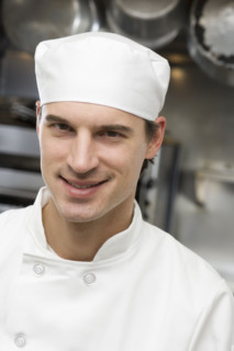 Male chef in restaurant kitchen.