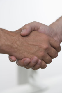 Closeup of men shaking hands.