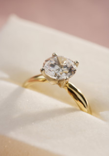 Closeup of a diamond engagement ring.