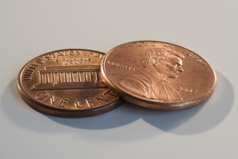 Close up of two pennies.
