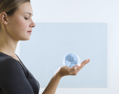 Woman holding small globe.