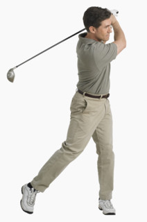 Studio shot of man playing golf.
