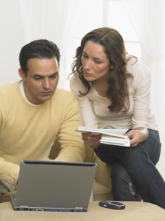 Couple working together at computer.