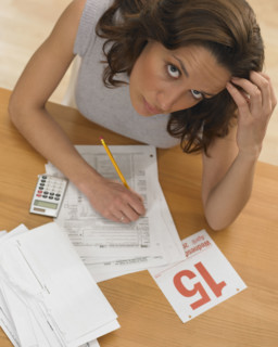Woman working against tax deadline.