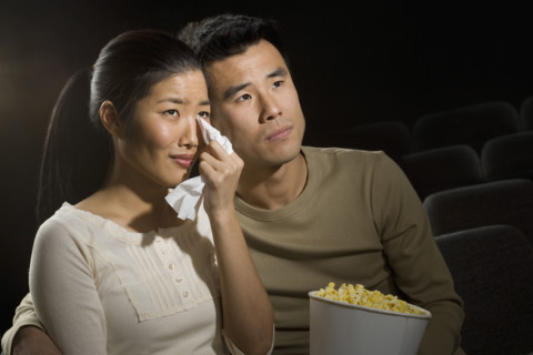 Couple watching a sad movie.