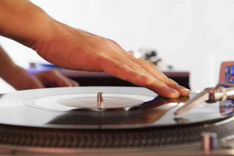 Person mixing sound from records.