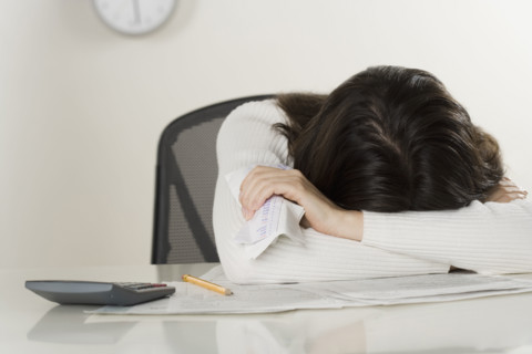 Woman working on paperwork.