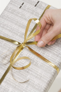 Hand on bow of present.