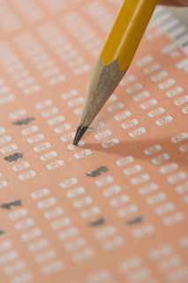 Filling out a lottery ticket.