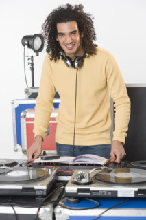 DJ with his music mixing equipment.