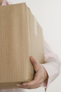 Woman carrying a box.