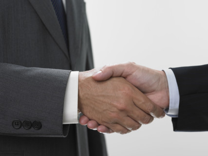 Two men shaking hands.