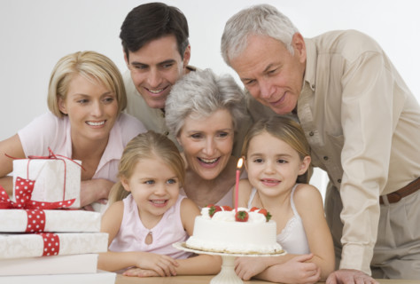 Girl celebrating birthday with family.