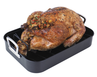 Roasted turkey in pan.