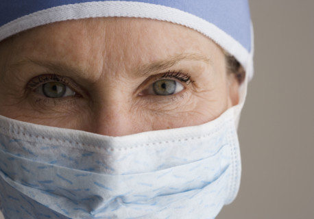 Close up of female doctor wearing surgical mask.