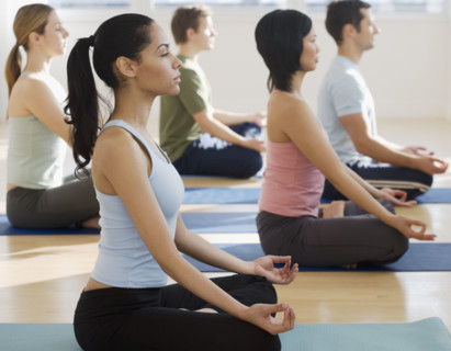 Group of people practicing yoga.