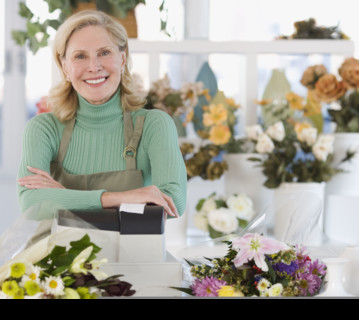 Portrait of female florist at cash register.
