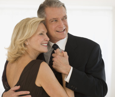 Studio shot of senior couple dancing.