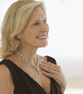 Senior woman wearing diamond necklace.