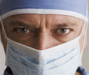 Close up of male doctor wearing surgical mask.