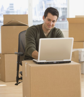 Businessman working in new office.