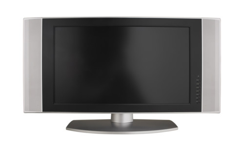 Wide screen television on table.