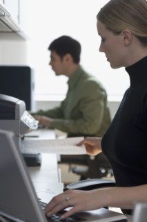 Businesspeople working at desks.
