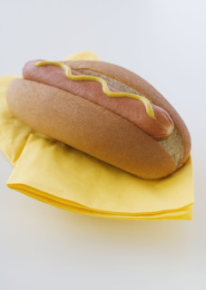 Close up of hot dog in bun.