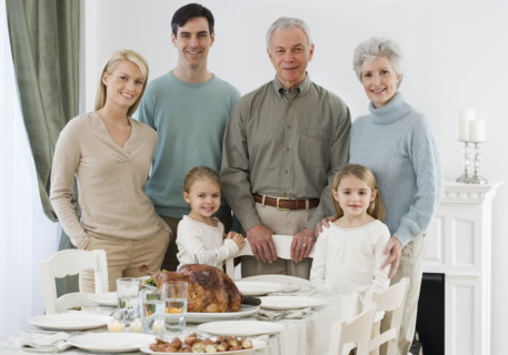 Portrait of family at Thanksgiving table.