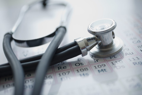 Close up of stethoscope on periodic chart.