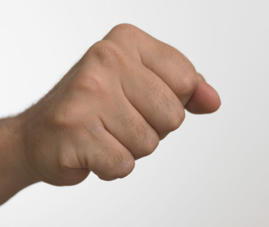 Studio shot of man's hand making fist.