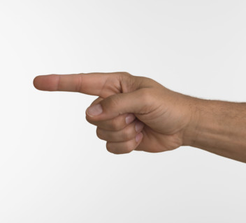 Studio shot of man's hand pointing.